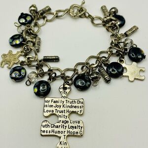 Charm Bracelet with Puzzle Pieces and Black Beads. Toggle Closure. 7 inches